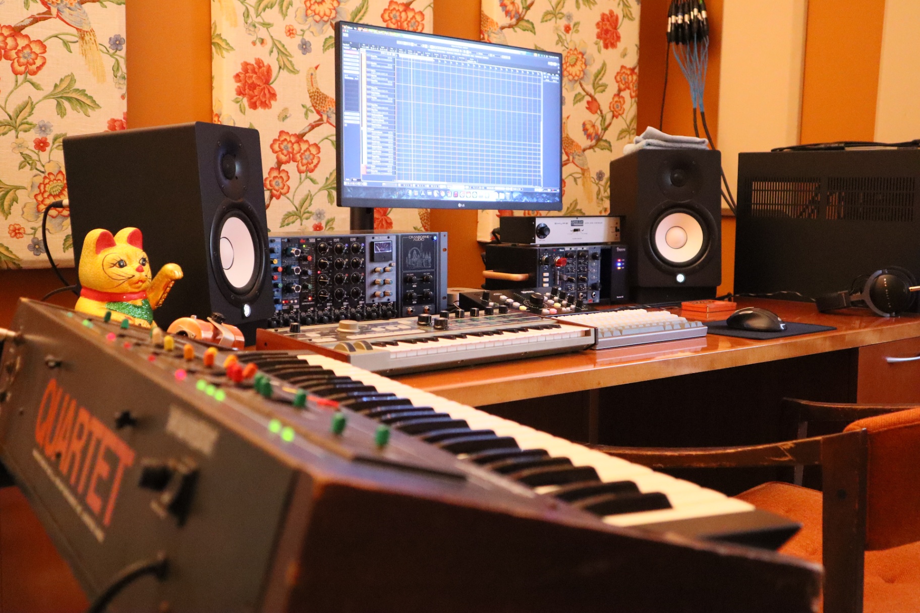 Control room with monitors and synths