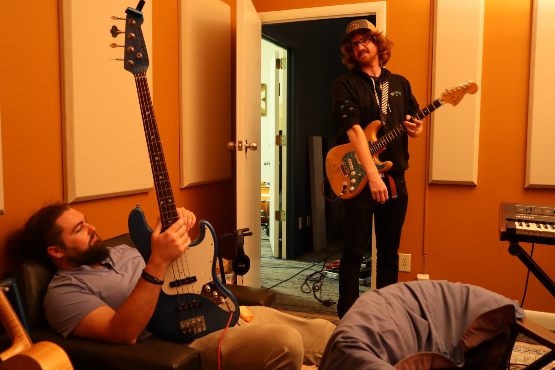 Musicians tracking guitar and bass