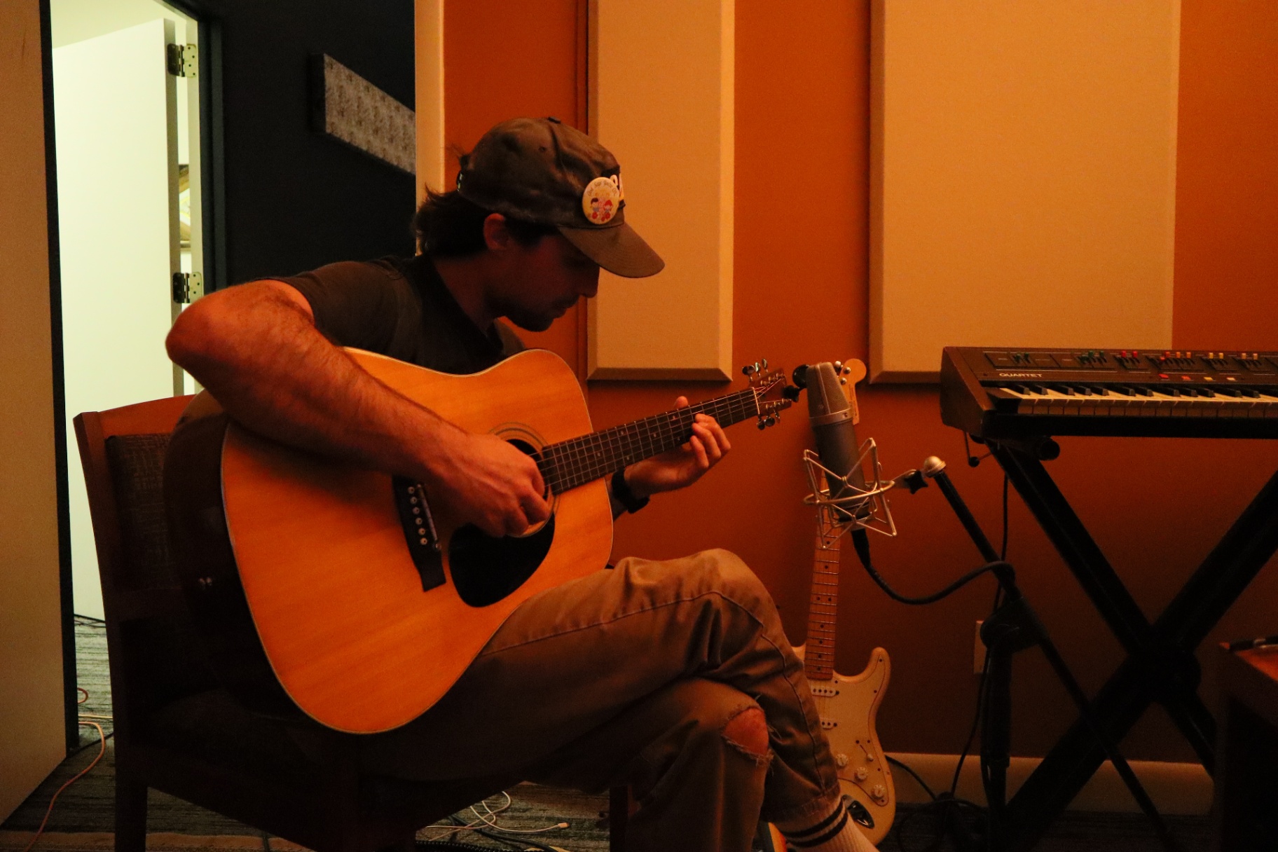 Acoustic guitar miked up for tracking